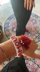 Bracciale di perline fatto a mano con scritta